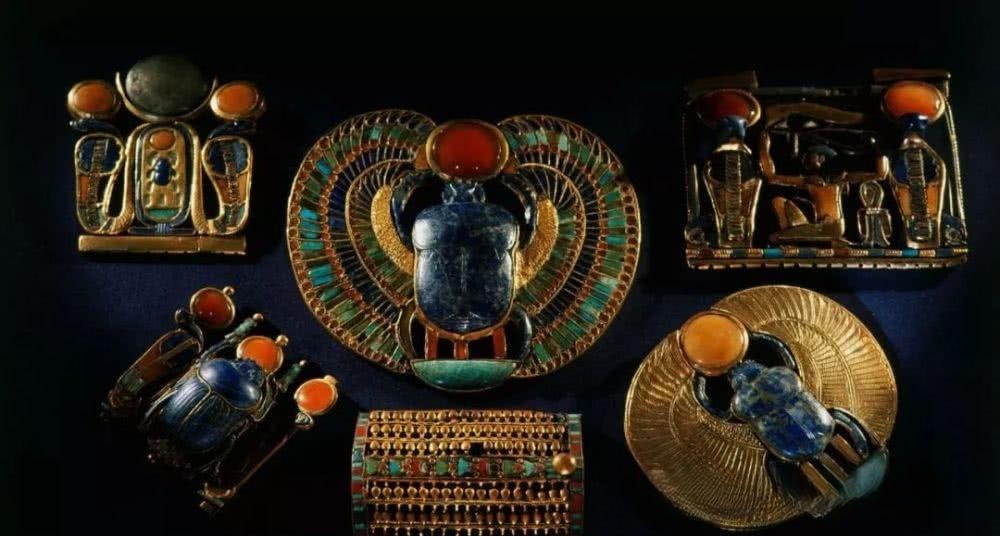 Ancient Egyptian jewelry collection featuring a  scarab bracelet and royal pectorals.