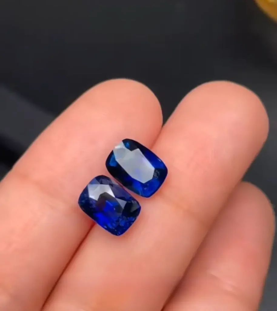 Two faceted blue “La Shui Bao”gems viewed from above, showing deep and even color saturation.