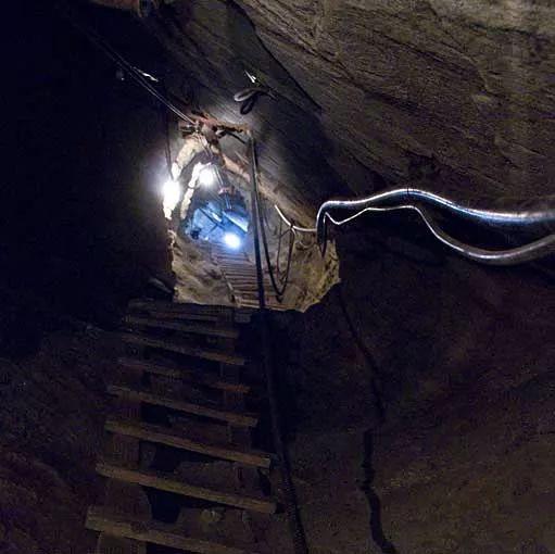 Interior view of an active Tanzanite mine shaft showing deep tunnels and rock walls in Tanzania.