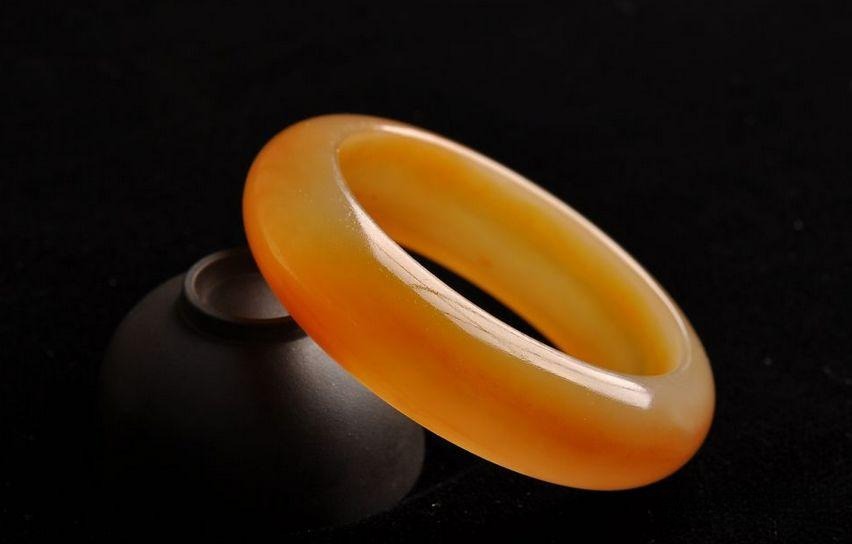 A vibrant yellow Huanglong jade bracelet from Longling, Yunnan.