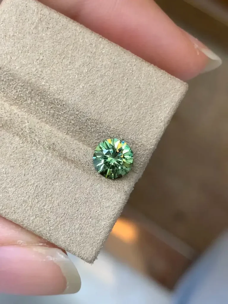 A flawless 1.03-carat Demantoid garnet exhibiting vivid green color and intense fire.