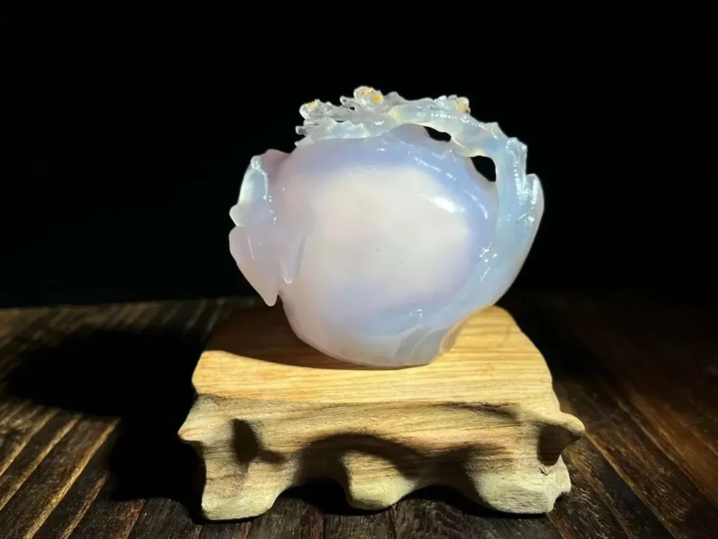 A 188g white Enhydro Agate ornament with a semi-translucent surface and internal water cavity.