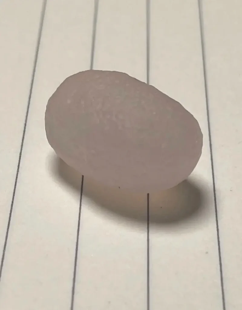 A 3cm oval Gobi Enhydro Agate with a clear cavity containing prehistoric water.