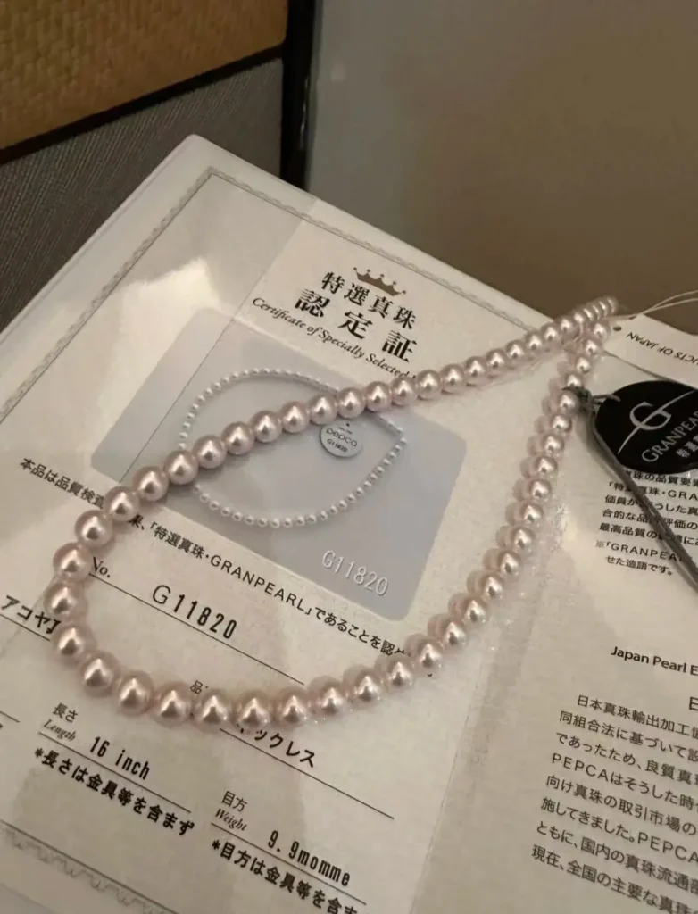 A 7.5-8.0mm Tokusen Akoya pearl necklace with an official JPEA Specially Selected certificate.