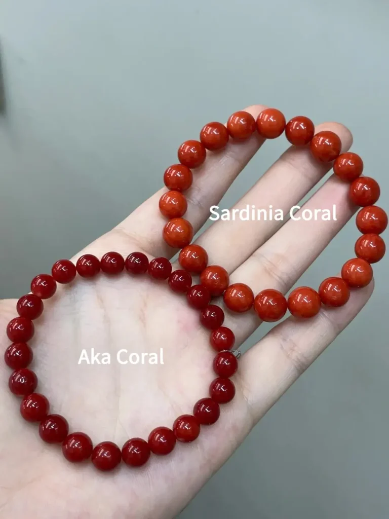 A side-by-side comparison of a round Aka red coral bracelet and a round Sardinia red coral bracelet.