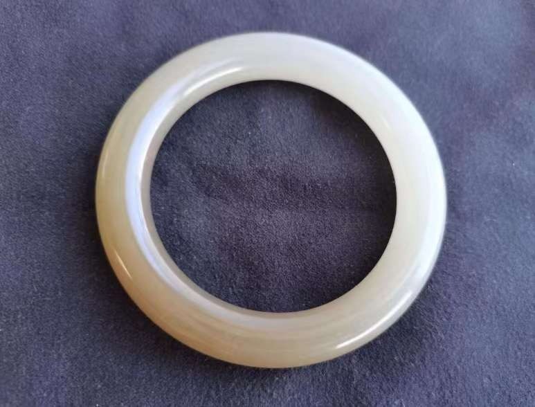 Polished Anhydrite bangle, a high-end fake Nephrite jade mimicking Sugar-White oily luster.