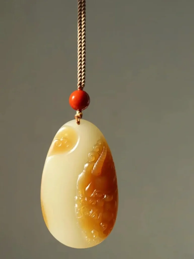 Natural Sugar-White Nephrite Jade pendant with a reddish-brown crust and creamy white body.
