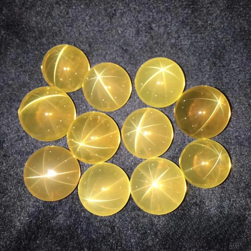 A collection of Brazilian 12-rayed Star Quartz cabochons displaying asterism, rare types of quartz crystals.