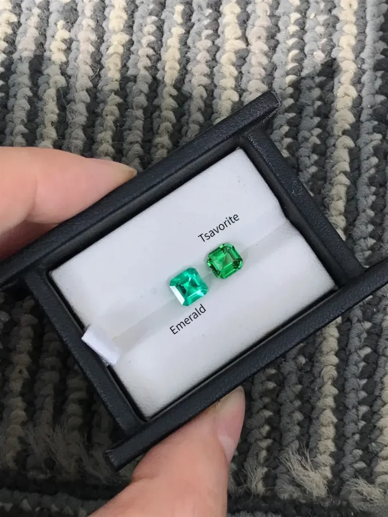 Cushion-cut emerald vs. tsavorite, showing high-saturation green as a natural, brilliant alternative.