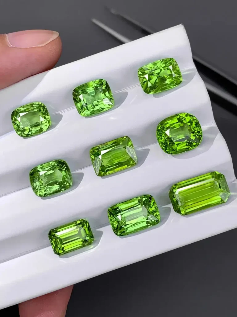 A collection of faceted sunstones from the Mogok old mines, showing brilliant aventurescence.