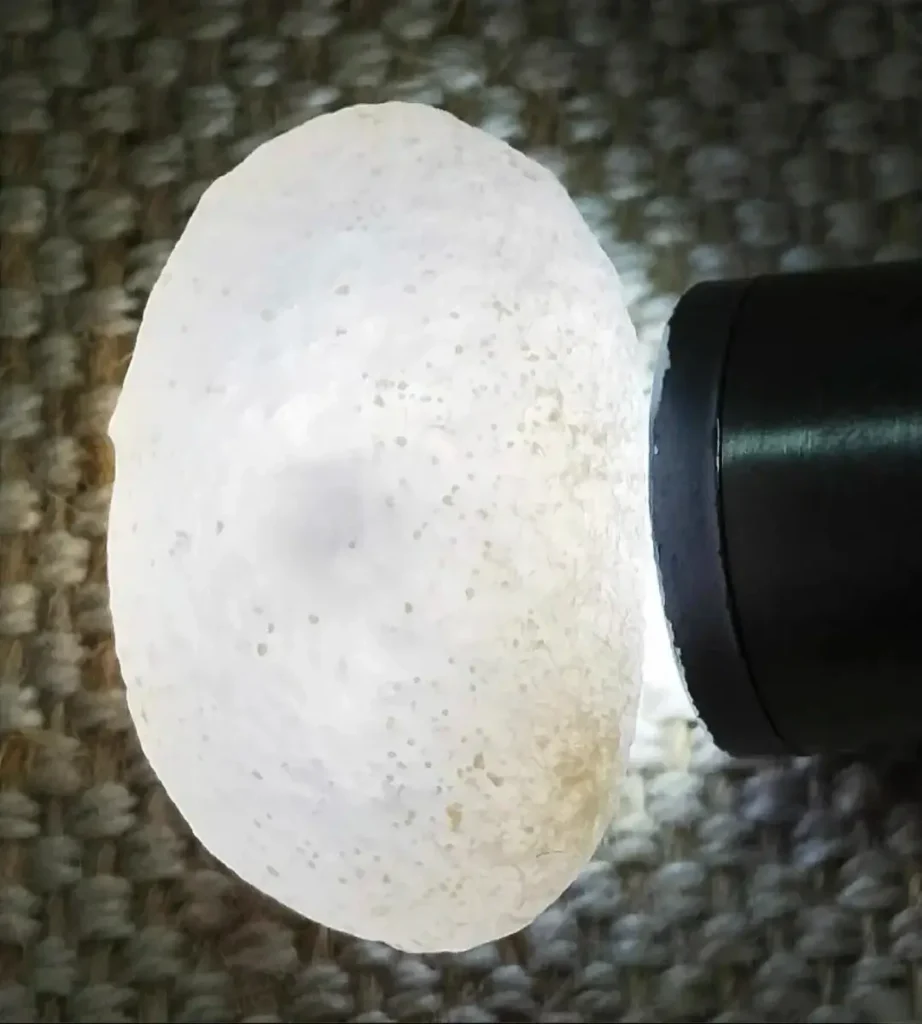 Natural Enhydro Specimen under focused light showing a consistent, seamless mineral surface.