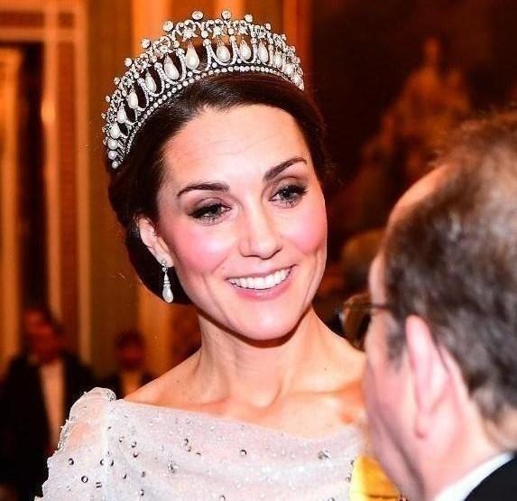 Kate Middleton wearing the Cambridge Lover's Knot Tiara featuring drop pearls and diamonds.