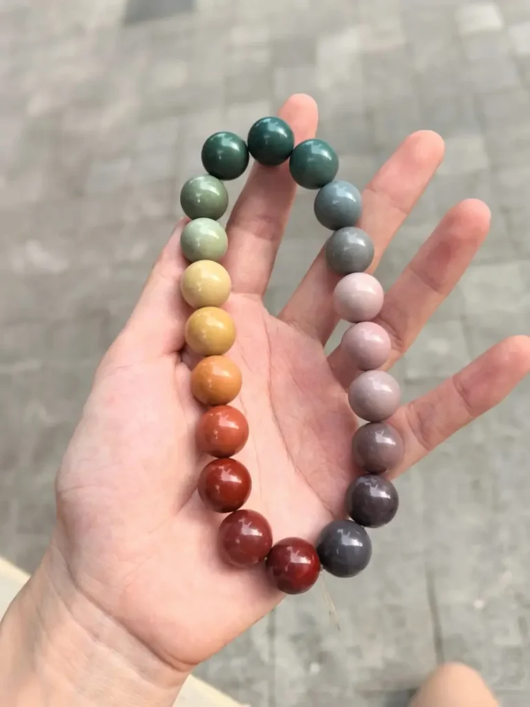 Polished Alashan bracelets featuring deep green, red, pink, purple, and yellow beads.