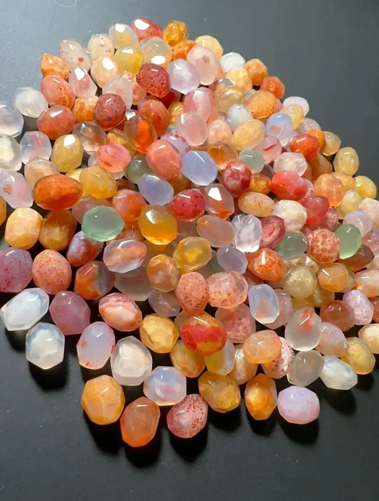 Assorted Alashan Sugar-Heart Agate stones with translucent husks and colorful solid cores.