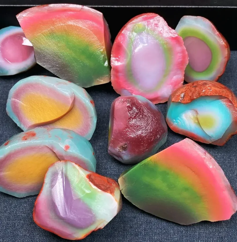 Rainbow-like spectrum of Yanyuan Agate showing natural yellow, green, red, and purple pastel hues.