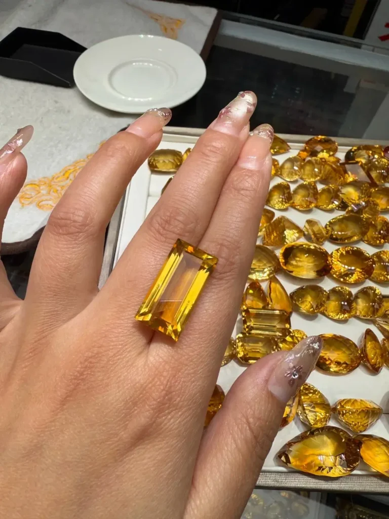 A radiant yellow Citrine gemstone from Donghai, showing deep honey-gold hues and high optical clarity.