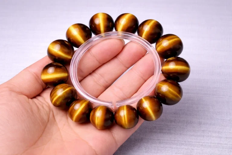 A high-quality natural Tiger’s Eye bracelet showcasing golden chatoyant beads under $100.