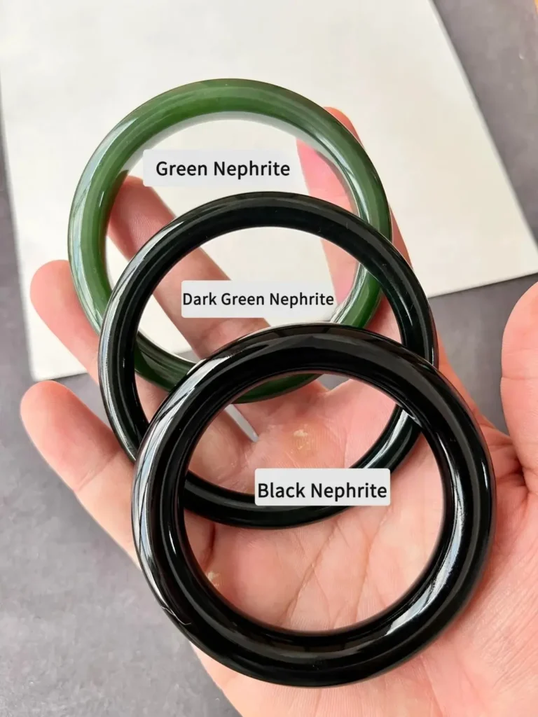 Side-by-side comparison of three Hetian jade bracelets: vibrant Green, Dark Green, and Black.