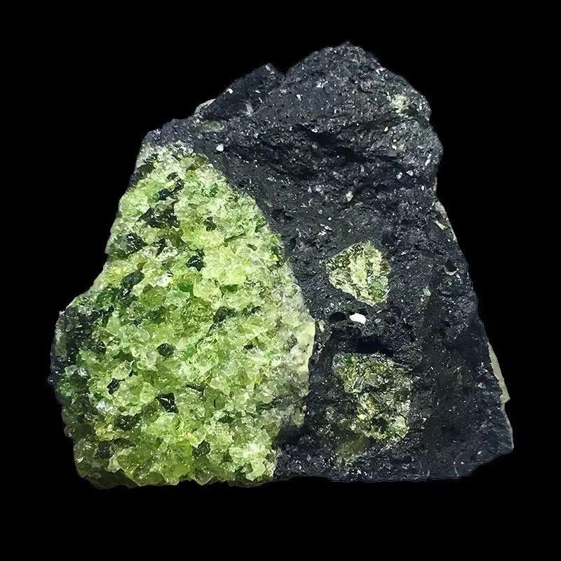 A sample of dark volcanic basalt rock partially encasing vibrant green peridot silicate crystals.