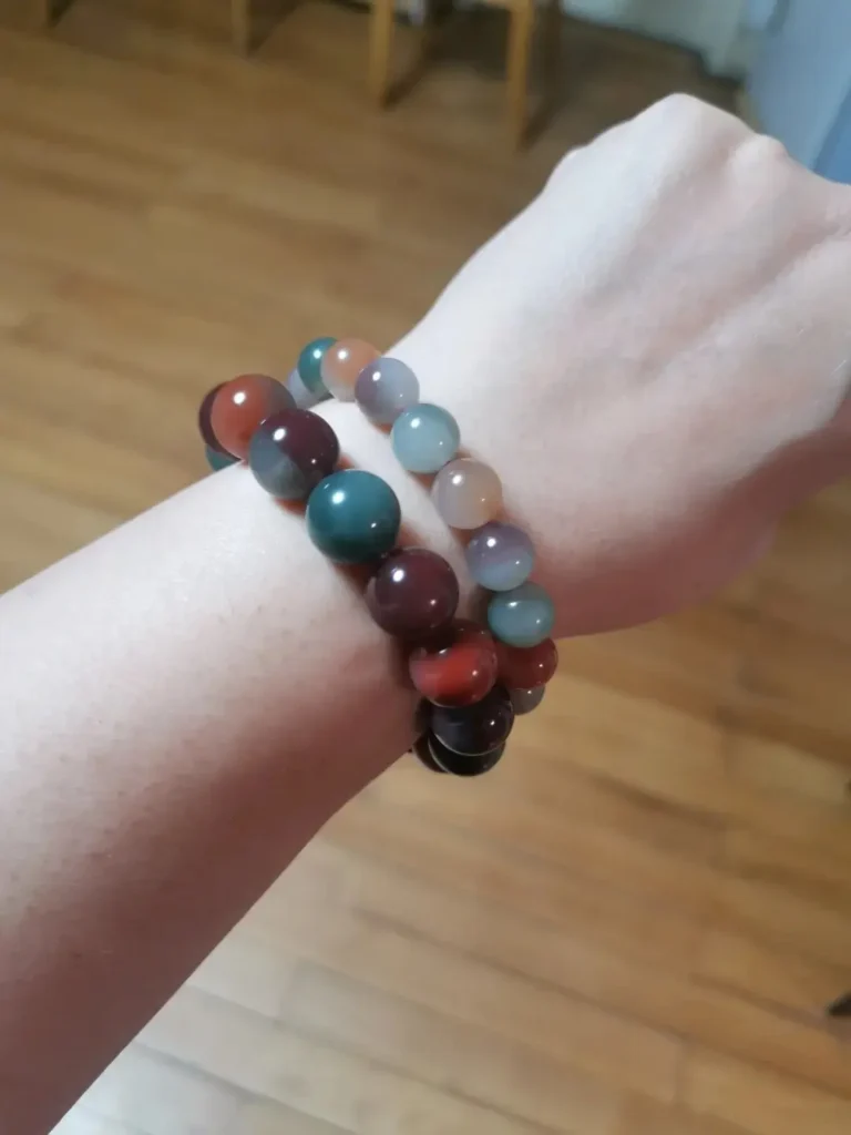 Two Purple-Green Agate bracelets: one with translucent beads and another with highly saturated tones.