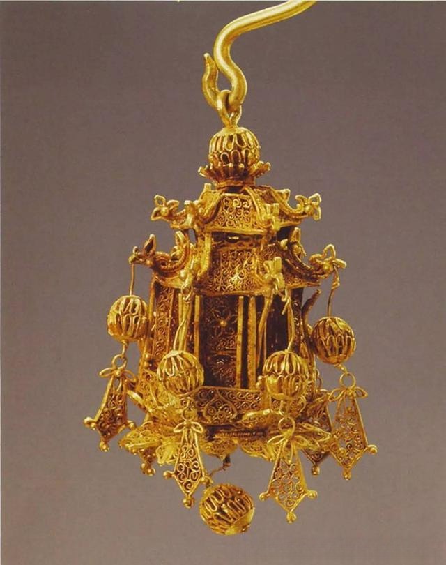 Qing Dynasty gold filigree earrings shaped like imperial palace lanterns with intricate wirework.