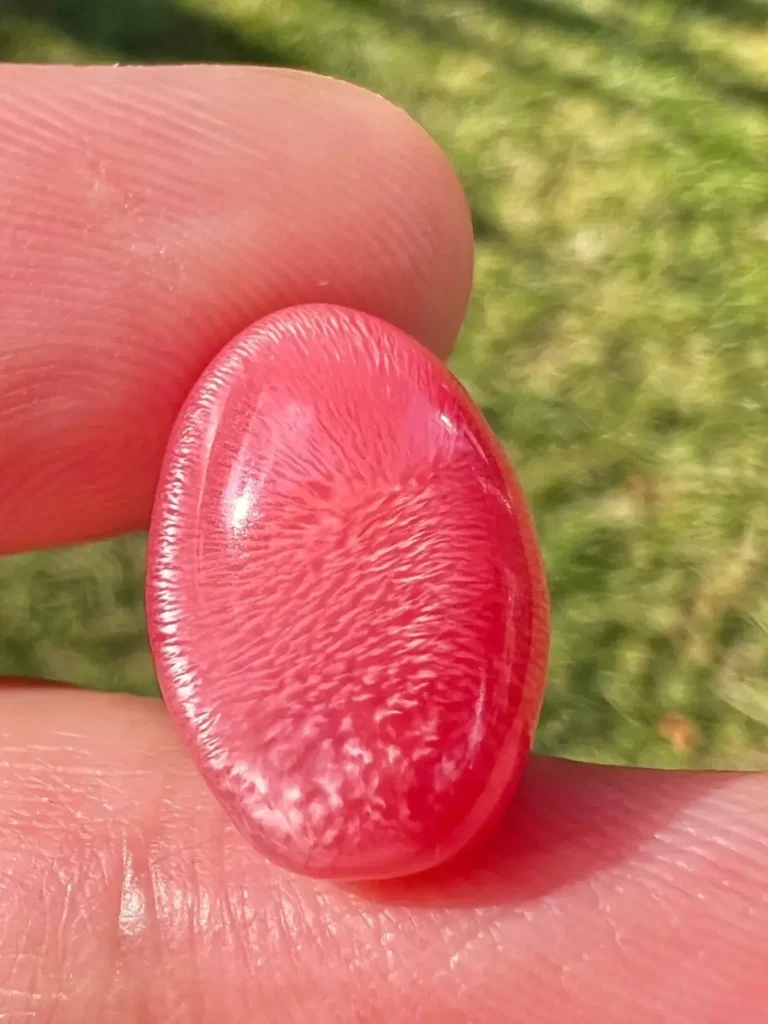 A rare 11+ carat conch pearl exhibiting exceptional flame structure and porcelain-like luster.