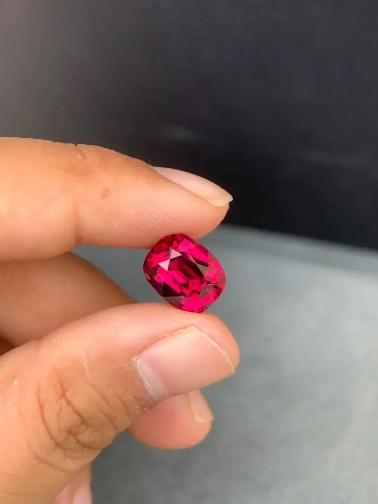 A vibrant 6-plus carat Malaya garnet, serving as a brilliant, budget-friendly alternative to high-end rubies.