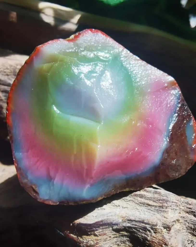 Macro shot of a Yanyuan Agate cross-section showing seamless transitions between pink and purple