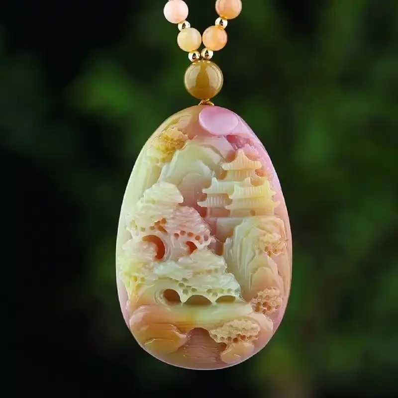 Yanyuan Agate pendant featuring multi-colored pavilions carved into its natural color zones.