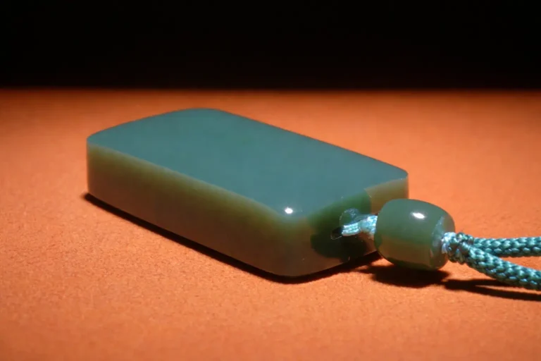 35g Dou Qing Hetian jade pendant with a dense, oily texture and no visible flaws.