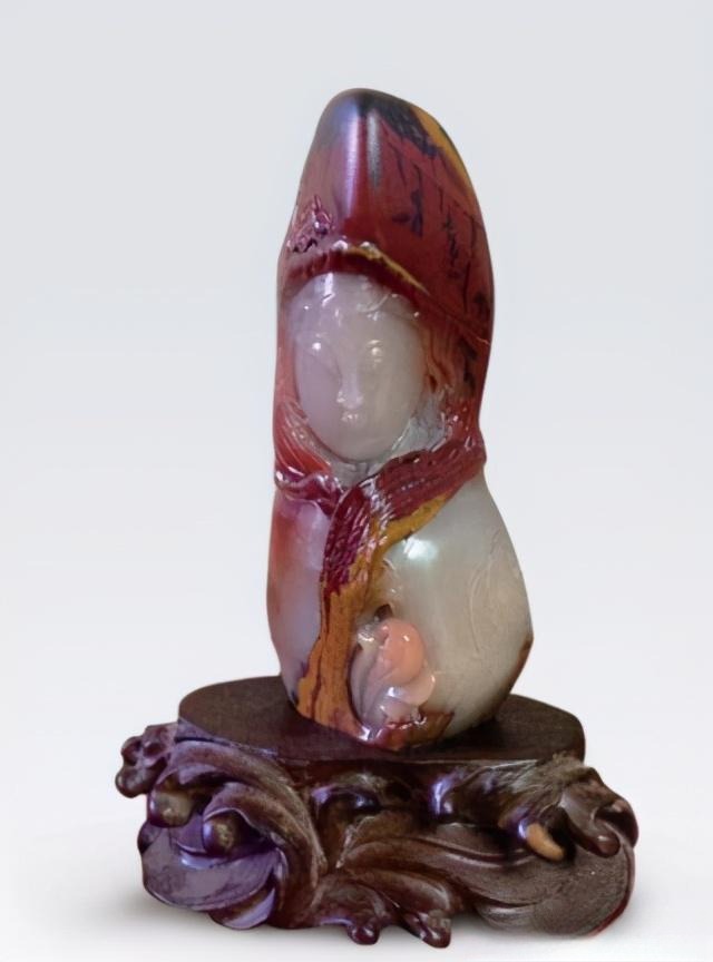 Jiangxi Yellow Wax Stone sculpture of a girl featuring white, red, black, and yellow color layers.