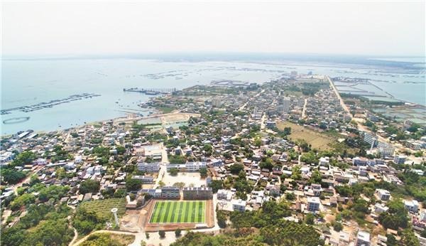 Aerial view of Liusha Village in Leizhou showing extensive pearl oyster farming rafts on the coast.