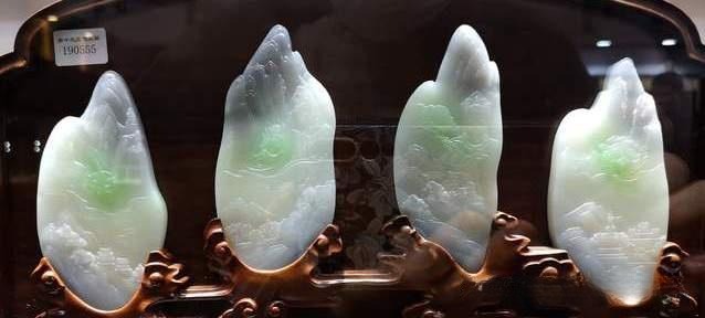 Hand-carved smoky purple nephrite with vivid green splashes, titled "Cool Sacred Land."