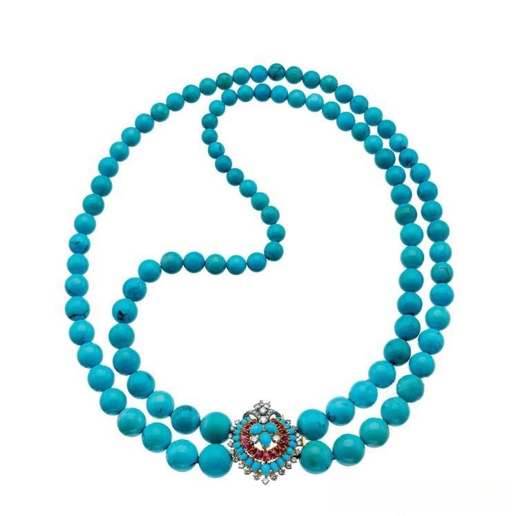 A Bvlgari white gold necklace featuring oversized beads and an intricate logo-engraved clasp.