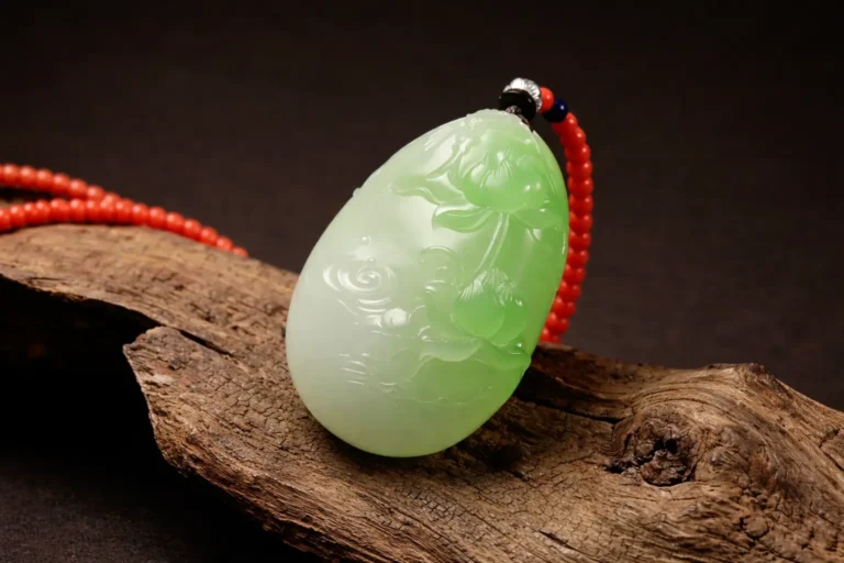 Lotus carved Cui Qing Nephrite pendant with fine texture and oily luster.