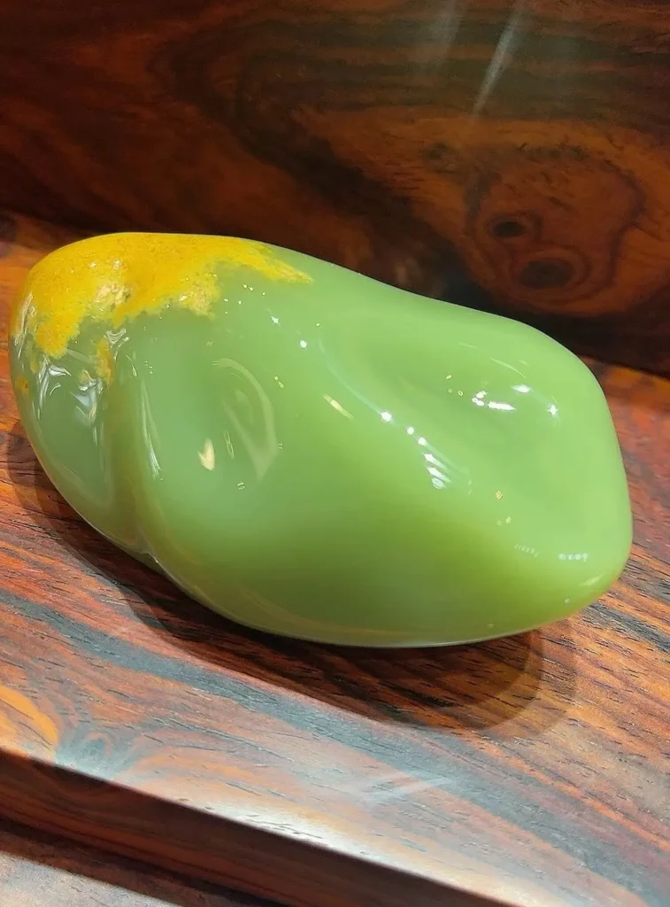 A high-quality raw Ximu Hemojade nephrite with an ultra-fine, structureless texture.