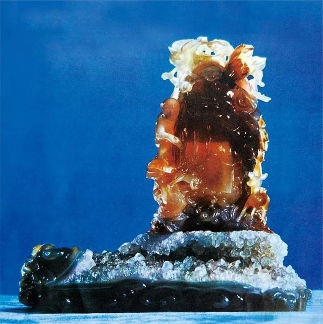 A masterfully carved "Water Curtain Cave" sculpture made from rare Fuxin enhydro water-gall agate.