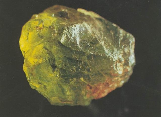 A large, high-clarity Hebei peridot gemstone with intense yellow-green saturation.