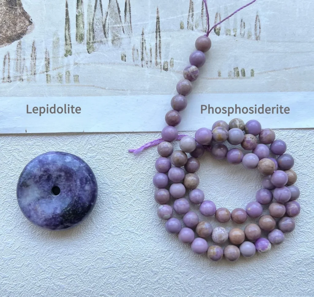 Comparison of a shimmering lepidolite pendant and matte purple phosphosiderite beads.