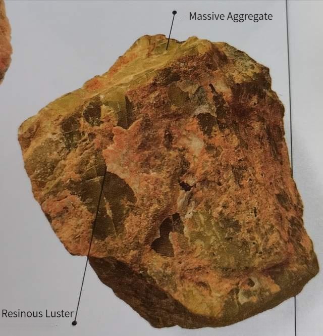 A dense, massive aggregate of Vesuvianite Jade raw stone with a distinct resinous luster.