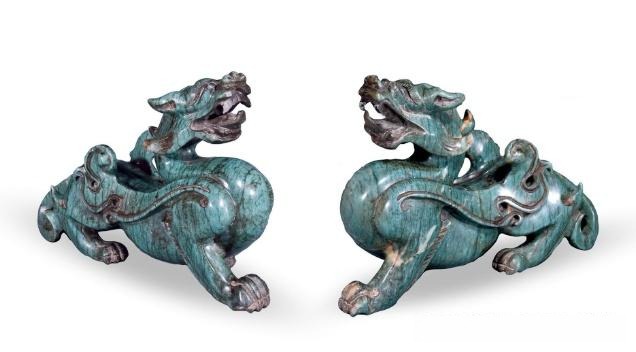 A pair of modern Lantian Jade carvings depicting mythical auspicious beasts with oily luster.