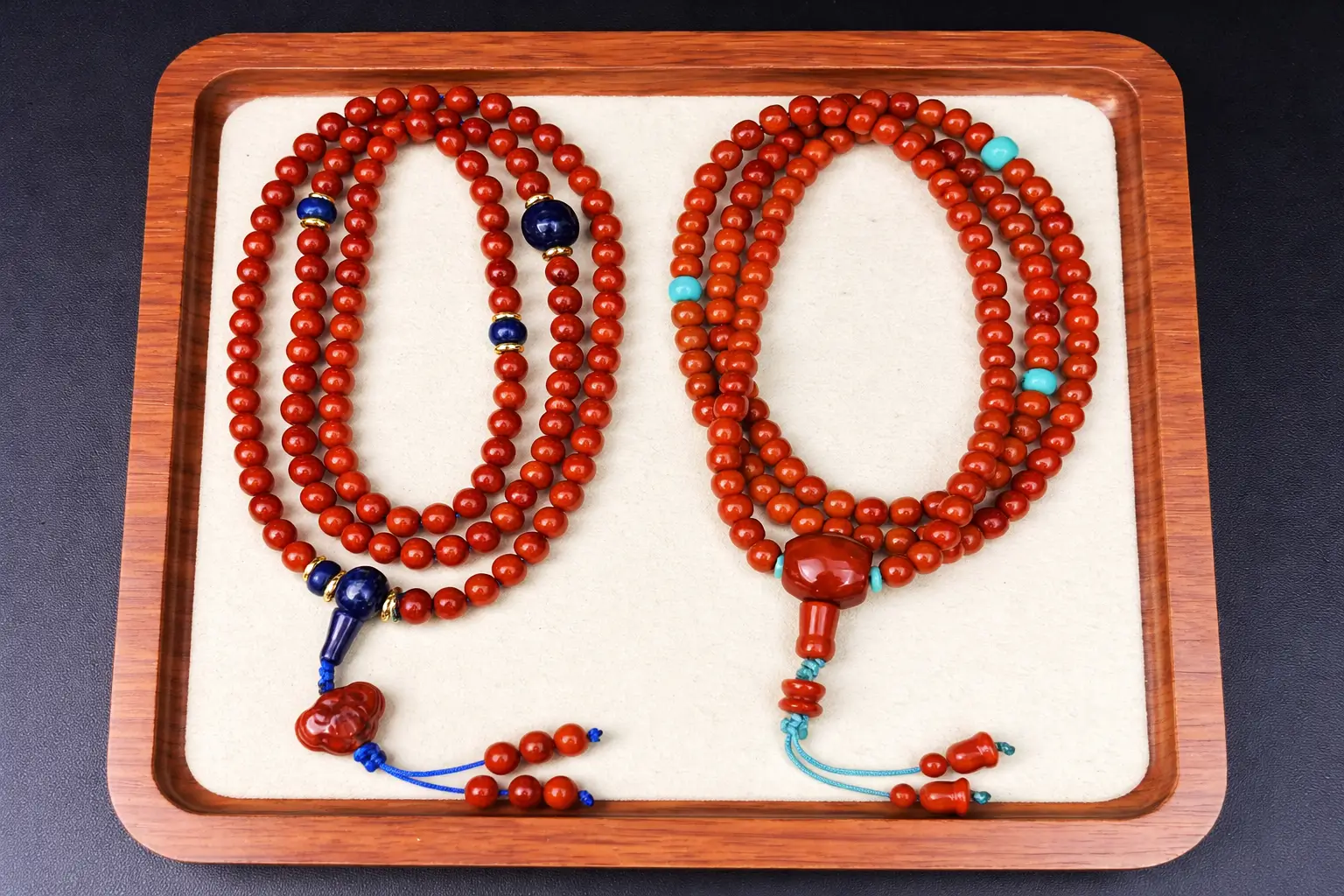 Two 108-bead Nanhong necklaces side-by-side, accented with turquoise and lapis lazuli.