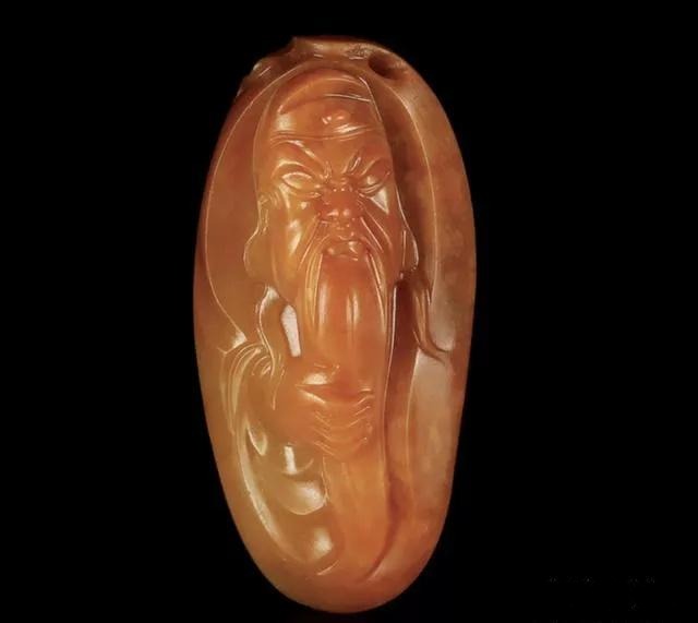 Yellow Infusion Nephrite Seed Jade Guan Yu pendant carved by Qiu Junyi.