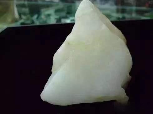 Raw milky white Dunhuang quartzite jade specimen from Gansu showing natural translucency.