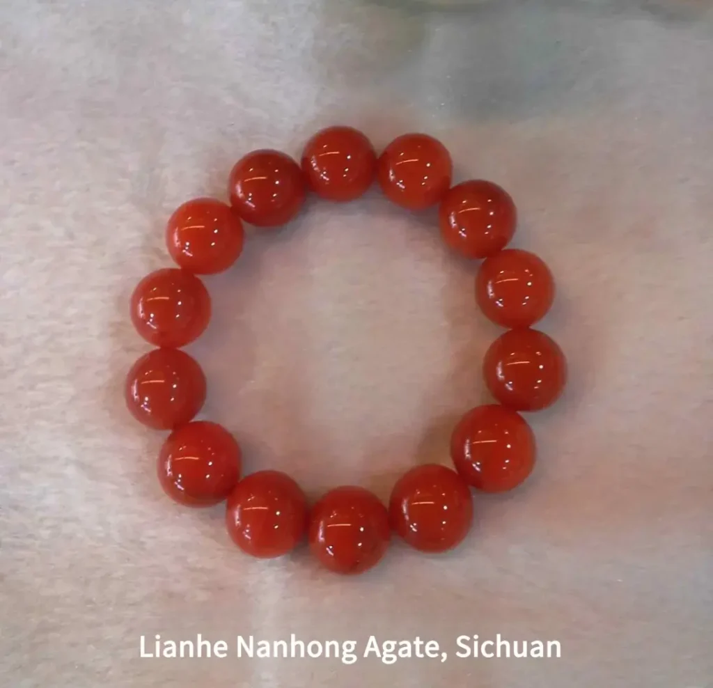 Translucent Lianhe Nanhong agate beads from Sichuan in bright cherry red.