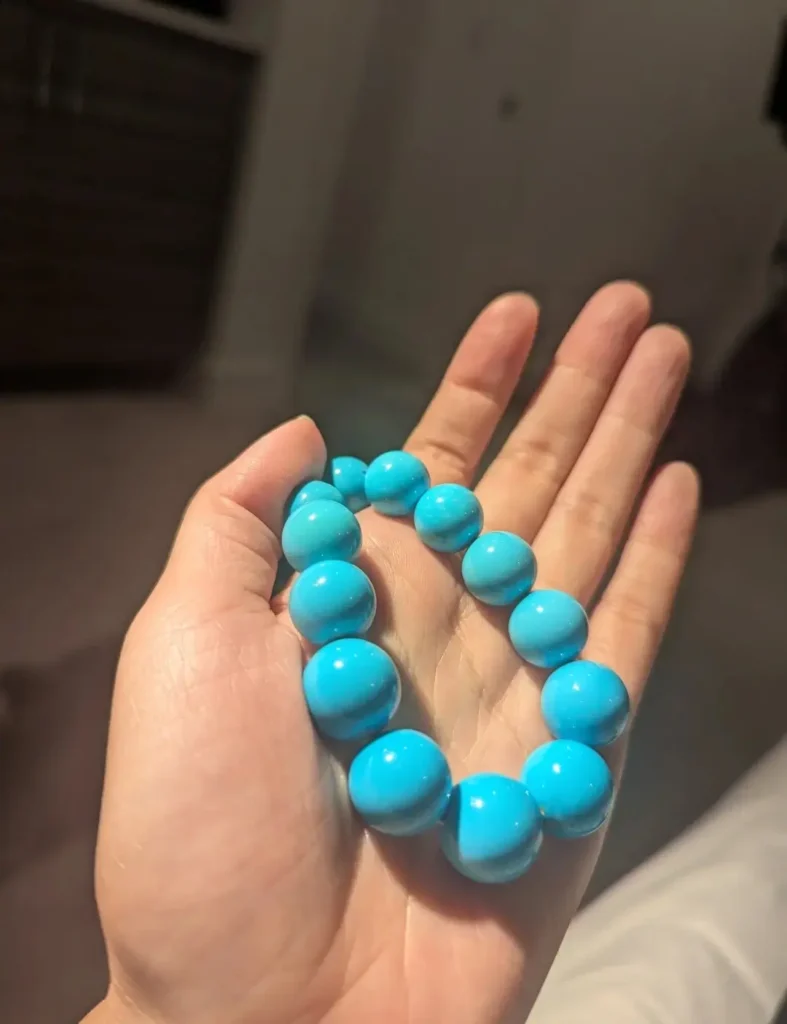 A 14-15mm necklace made of authentic Sleeping Beauty beads with a uniform sky-blue color.