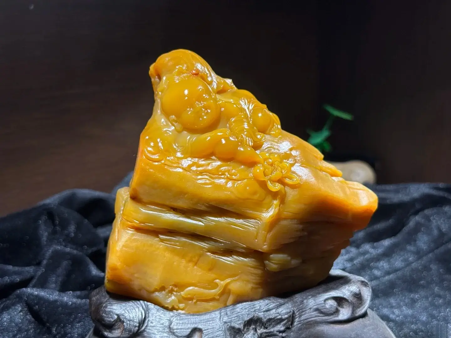 Carved Taishan Jade boy with lotus ornament, a premier example of the Gemstones of Guangdong.