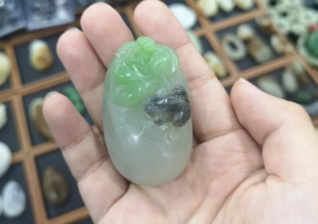 Tri-color Nephrite lotus carving with green, white, and smoky purple hues.