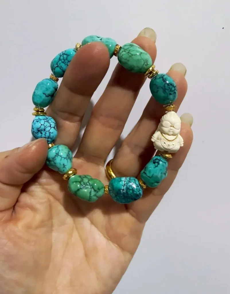 12-13mm natural freeform turquoise beads paired with mammoth ivory on a high-end beaded bracelet.