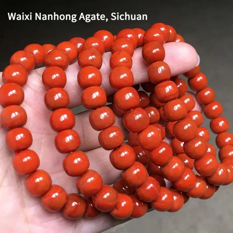 A collection of Waixi Nanhong bead bracelets from Sichuan in rich persimmon and rose red.